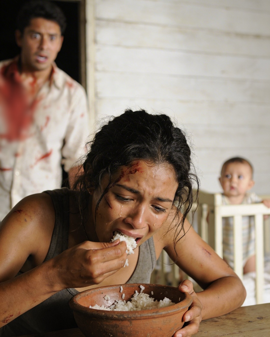 I gave my mother $1,500 a month to take care of my wife after childbirth… but when I returned early, I found her eating spoiled rice and fish bones. What I discovered next was even worse.