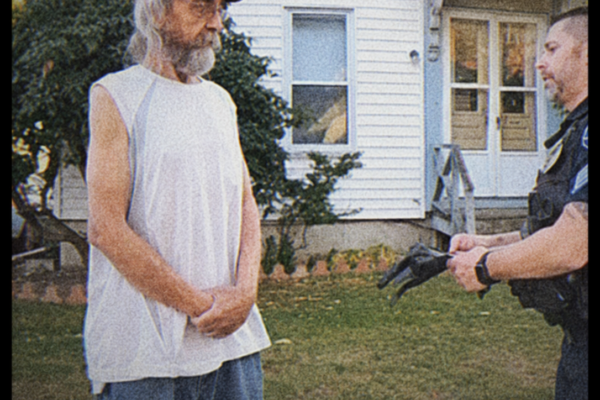 The first officer thought the woman standing barefoot in the driveway was a survivor. She kept asking whether her parents were alive, even though no one had told her where they had been found. Then a detective noticed something stranger: the emergency call that brought police to the house had come from a phone the woman insisted she had not touched all night. By sunrise, the question was no longer who had broken in. It was who had needed police to believe someone had.